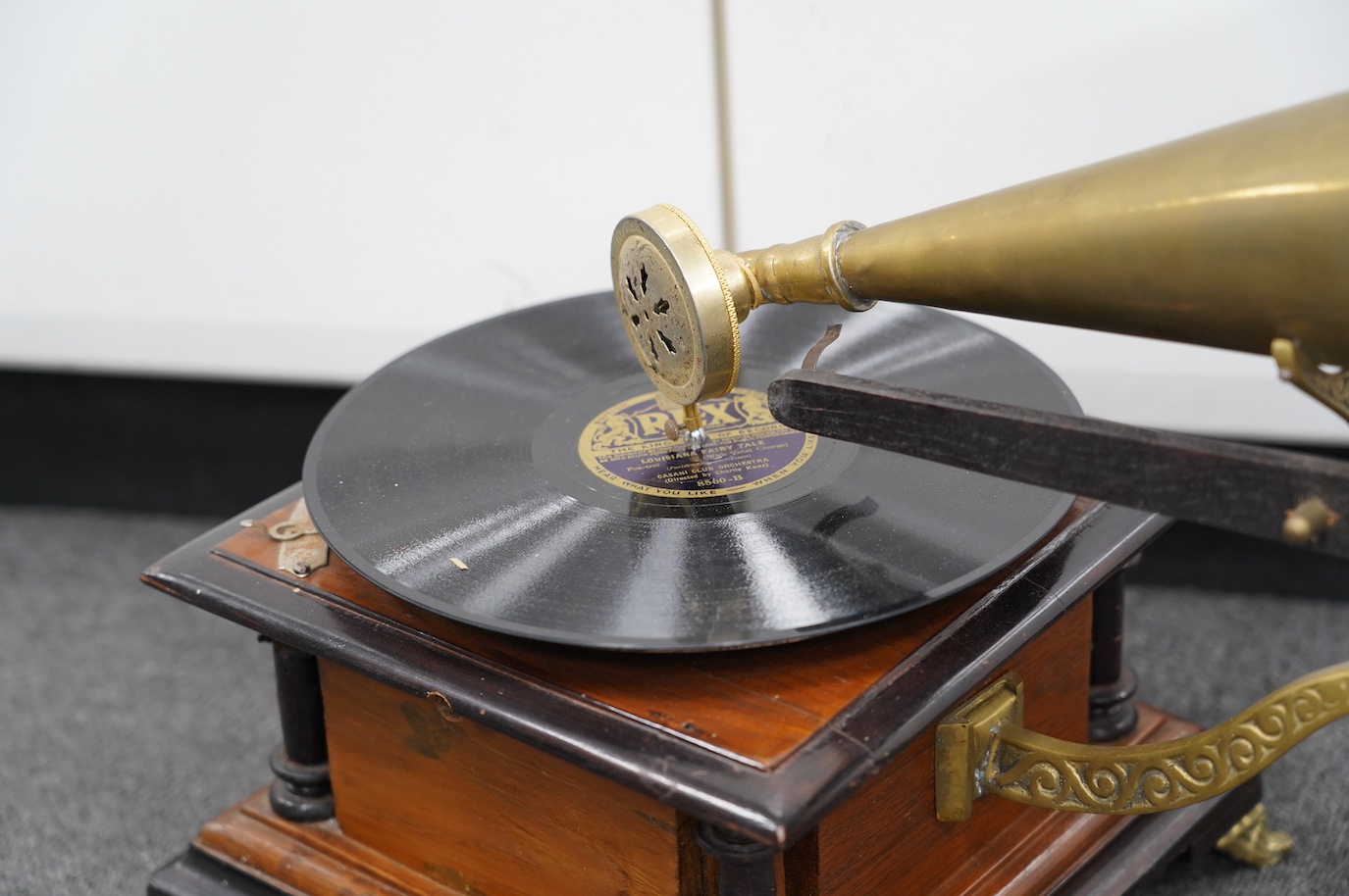 An early 20th century ‘His Masters Voice’ mahogany and ebonised gramophone with brass horn, base 29 x 29cm. Condition - fair